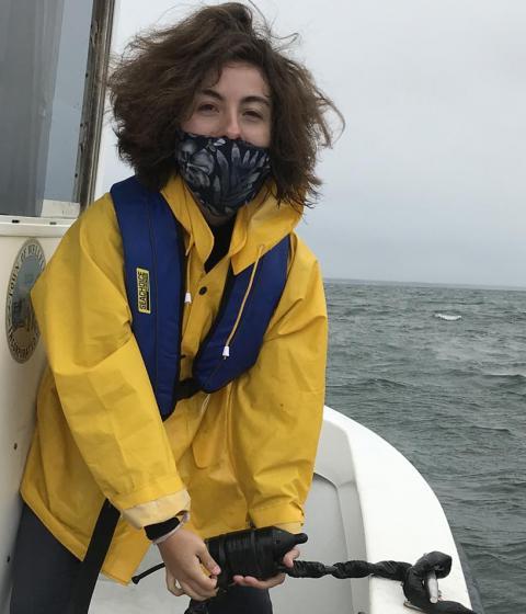 Student Molly Dent on a boat on the ocean