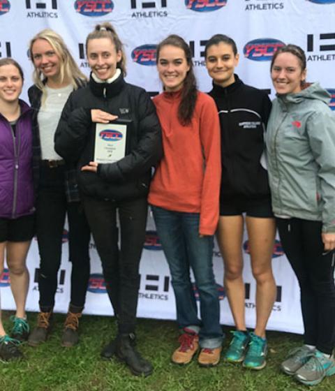 Women's Cross Country winners stand with awards