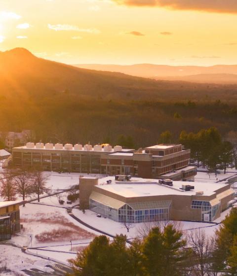 aerial view of campus with snowy sunset
