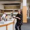 Students chatting at the library desk.