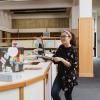 Student standing in the library.